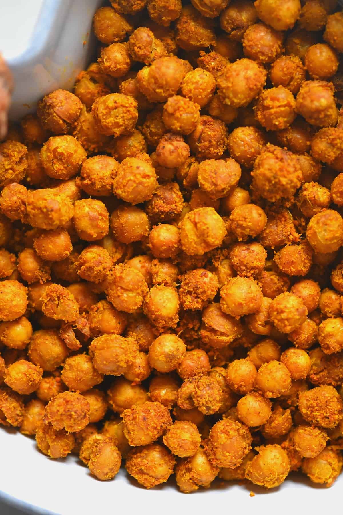 A close up of roasted chickpeas in a bowl