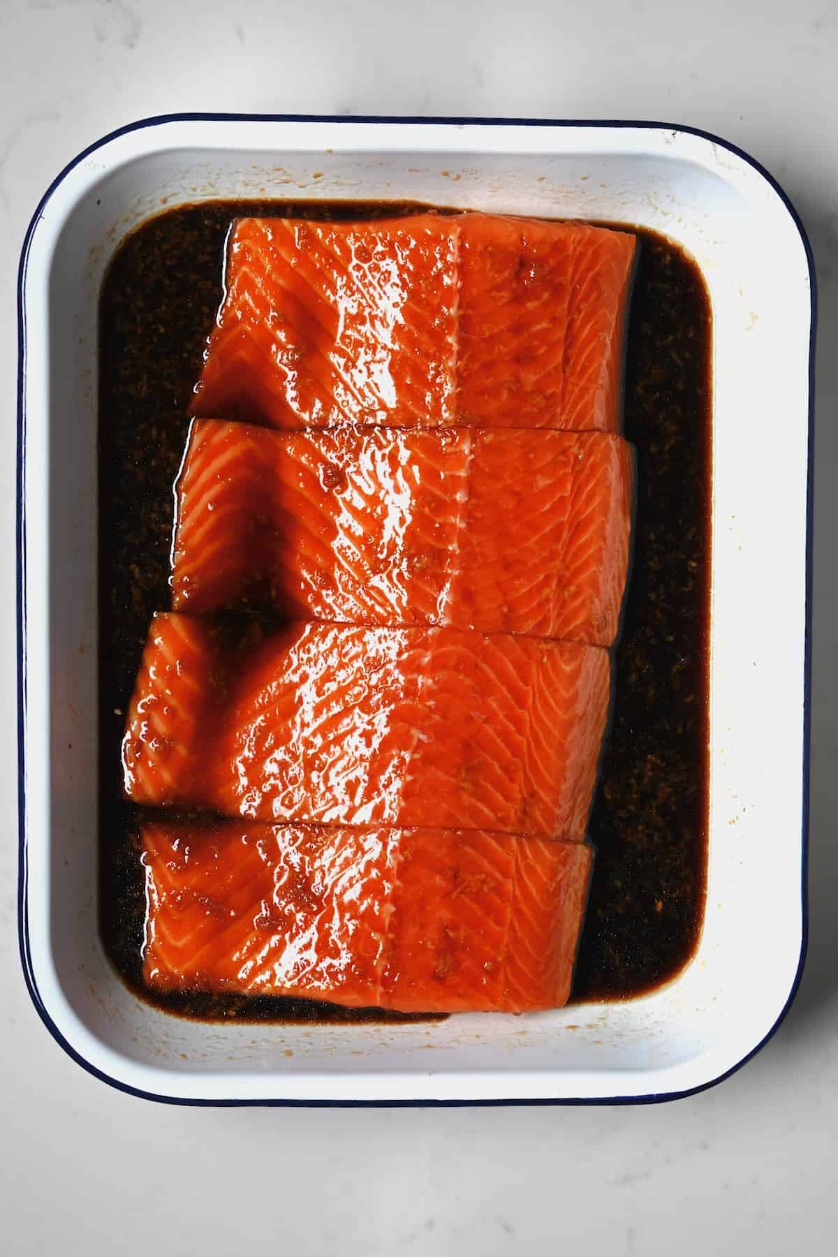 Salmon marinating in teriyaki sauce