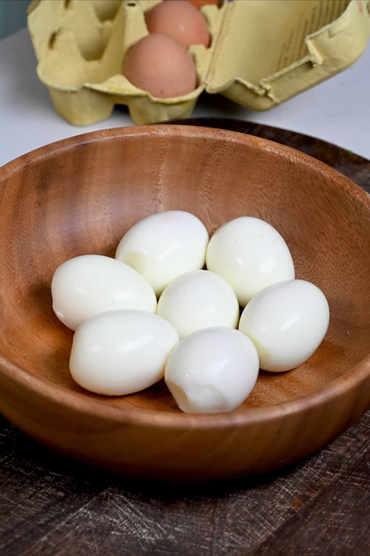 Seven peeled eggs cooked in air fryer