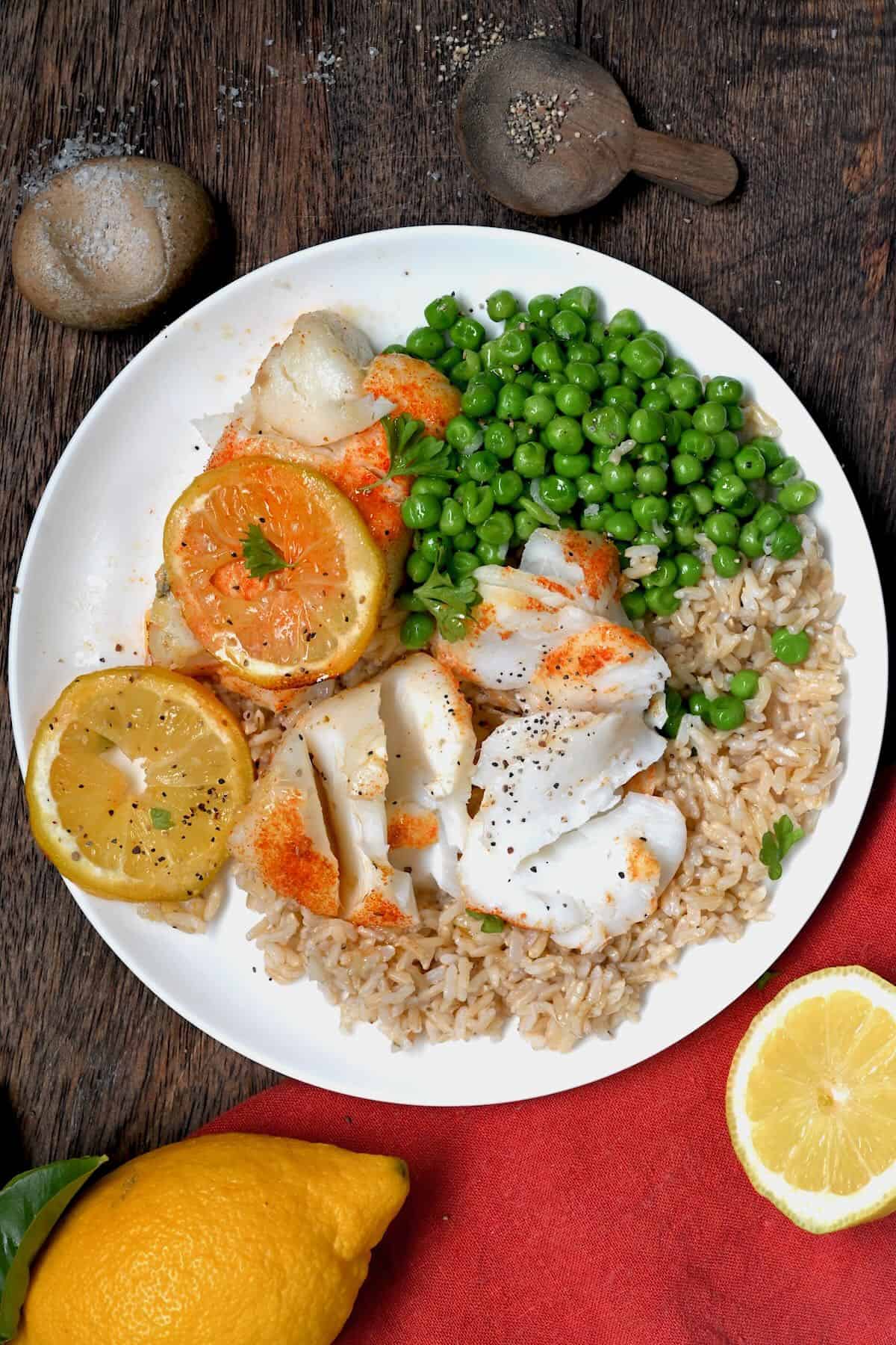 Air fried cod served with rice and peas