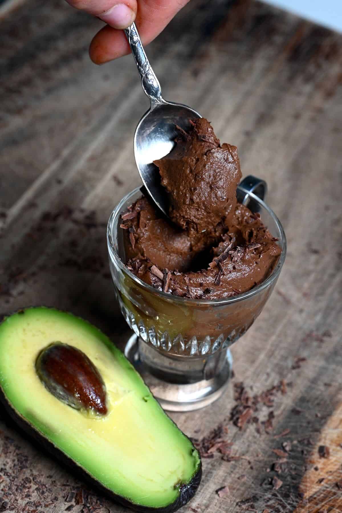 A spoonful of chocolate mousse with avocado