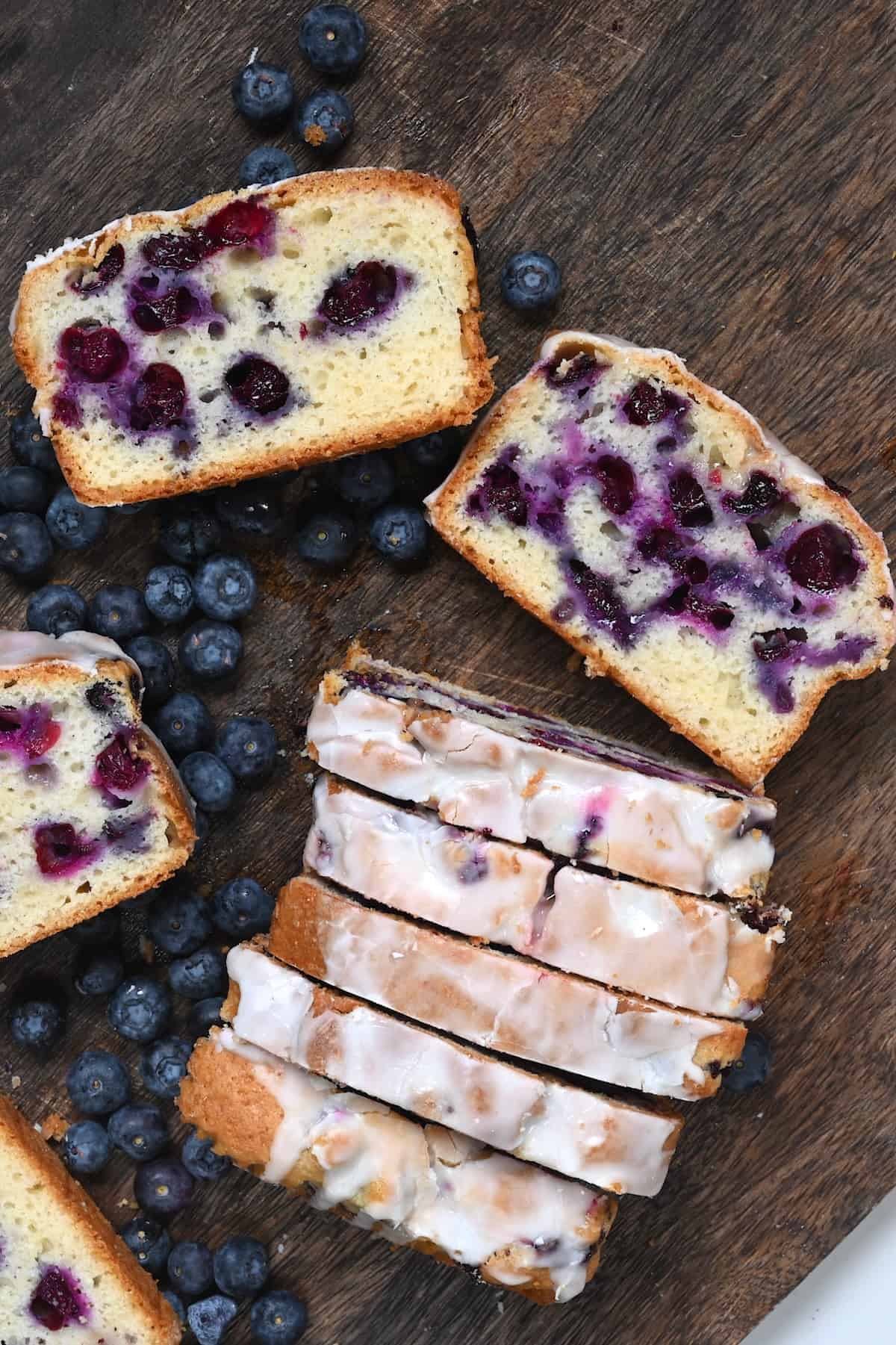 Sliced blueberry bread on a board