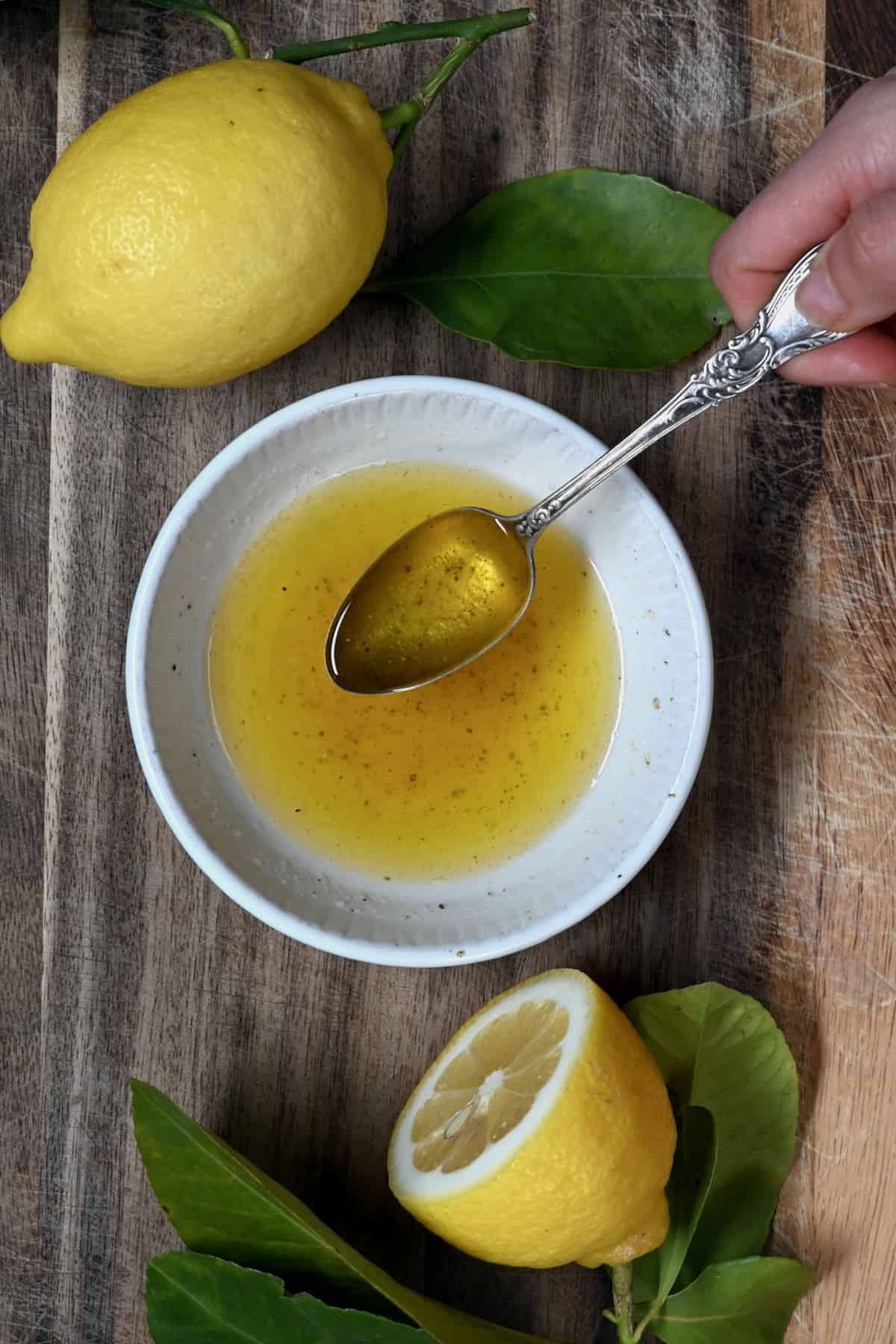 Lemon butter sauce in a small bowl