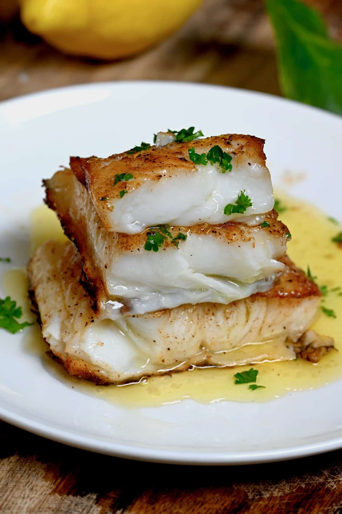 Pan-seared Chilean sea bass topped with lemon butter sauce