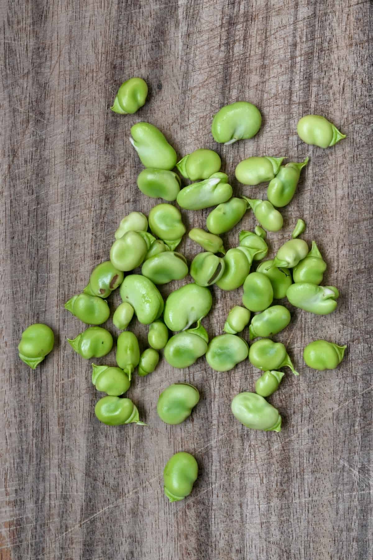 Fava beans on a chopping board