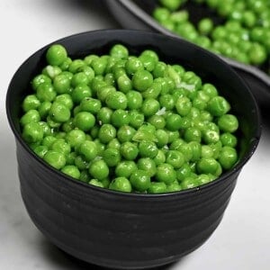 A serving of sauteed green peas
