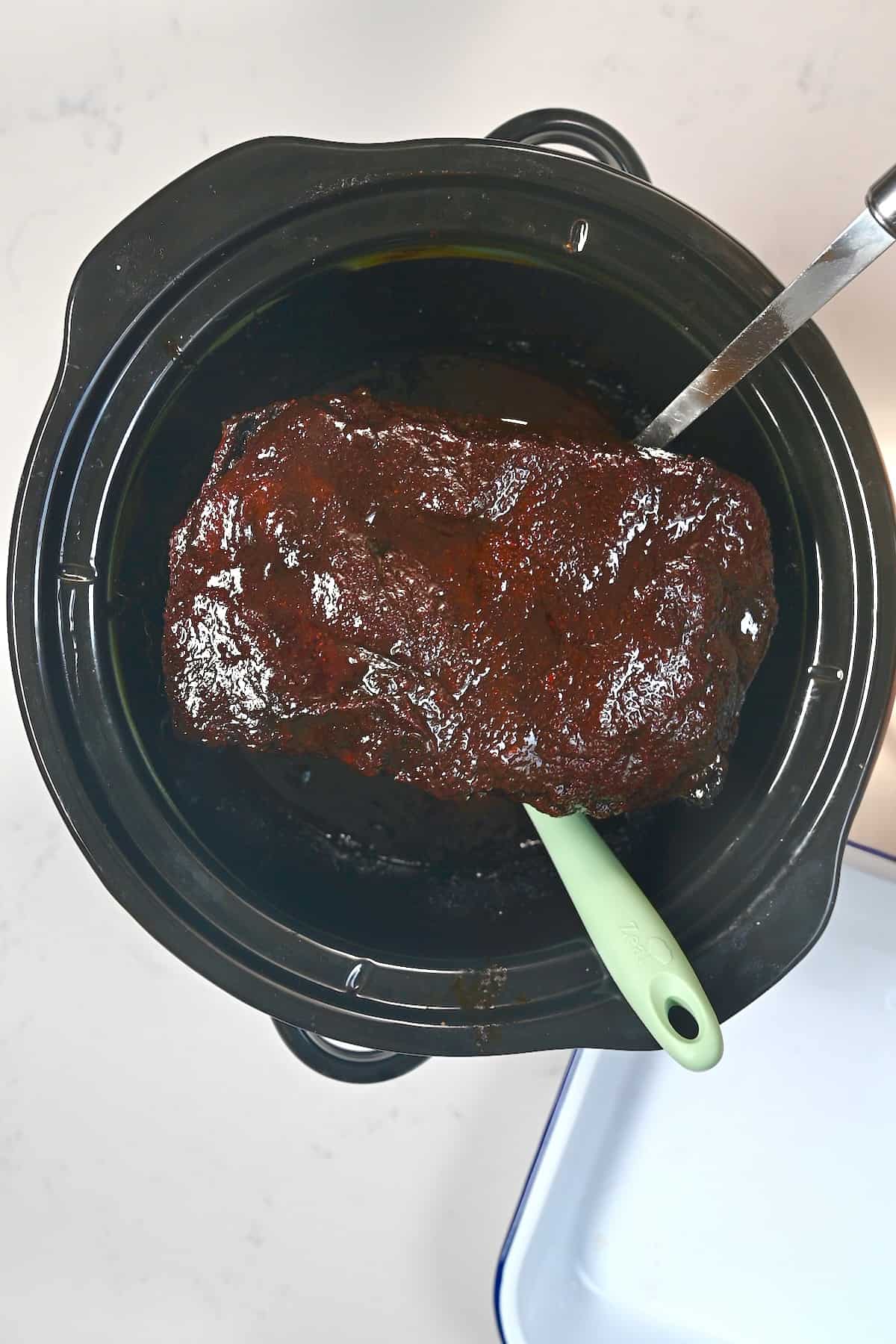 Beef brisket cooked in a slow cooker