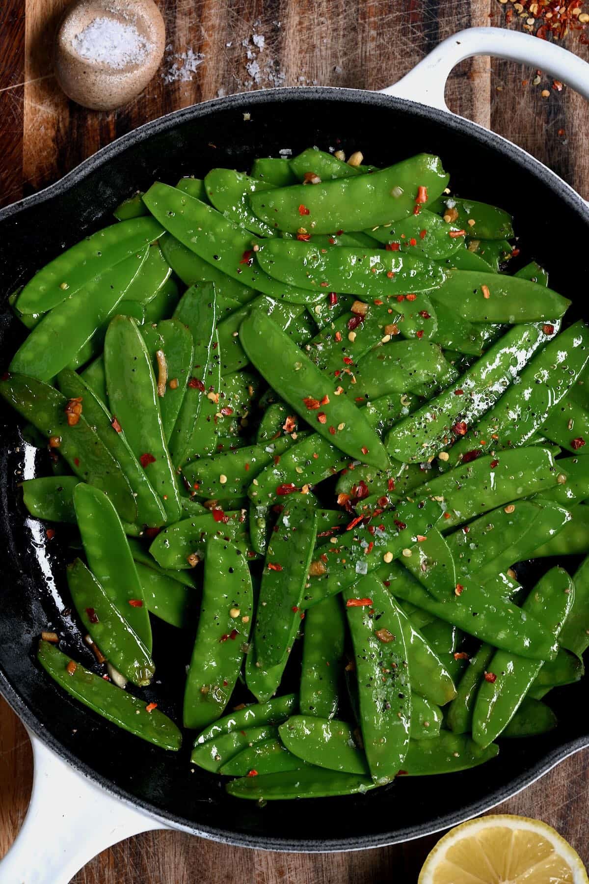 Sauteed snow peas in a skillet