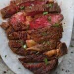 A serving of ribeye steak cut into slices - 11