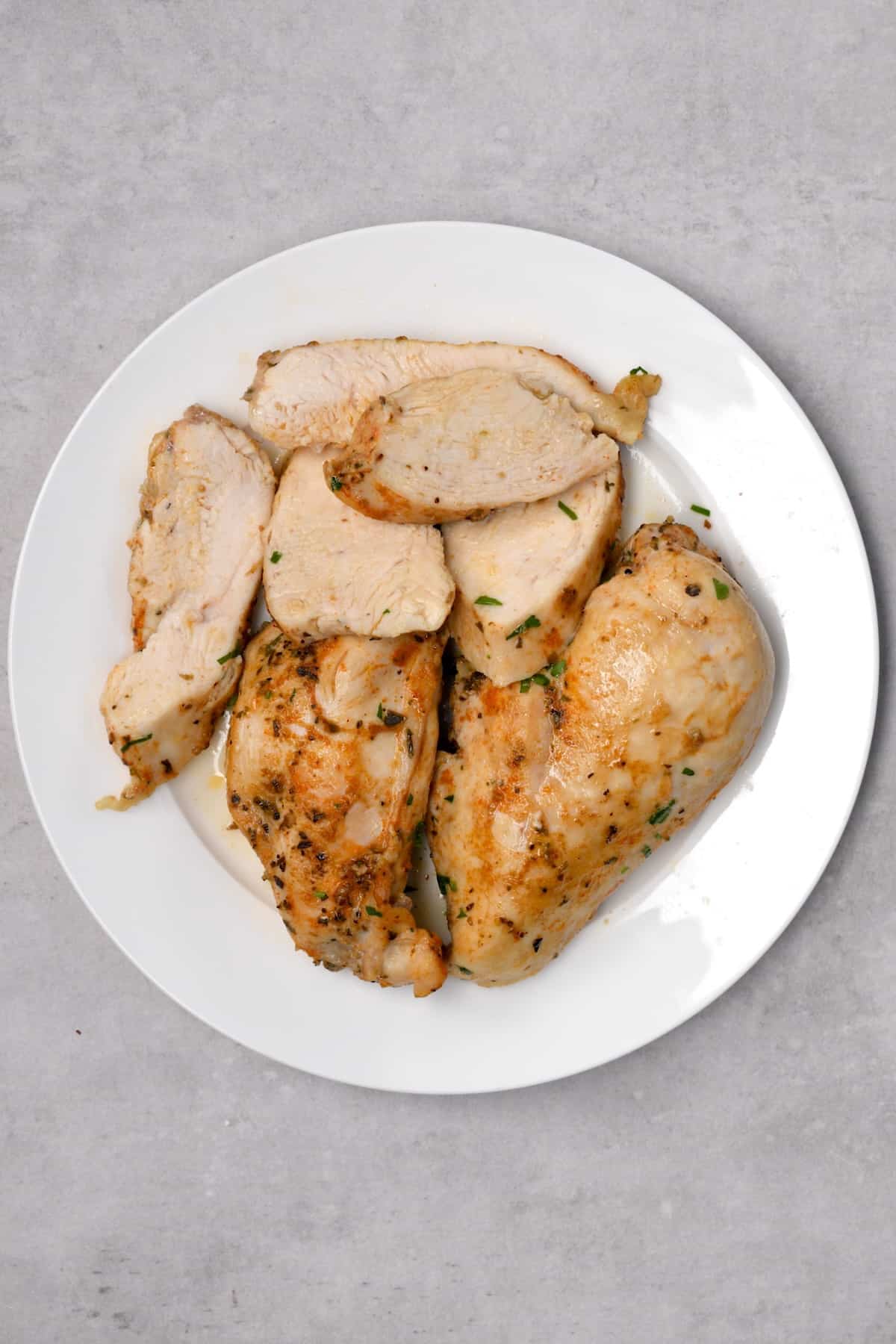 Cooked chicken breasts on a plate