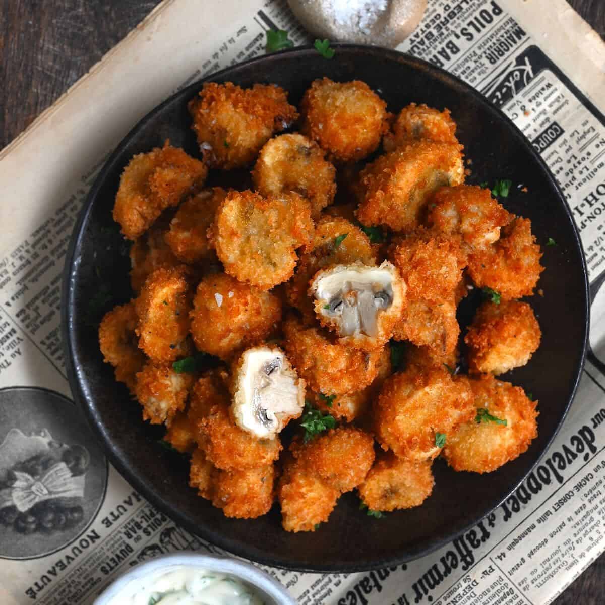 A bowl with fried mushrooms