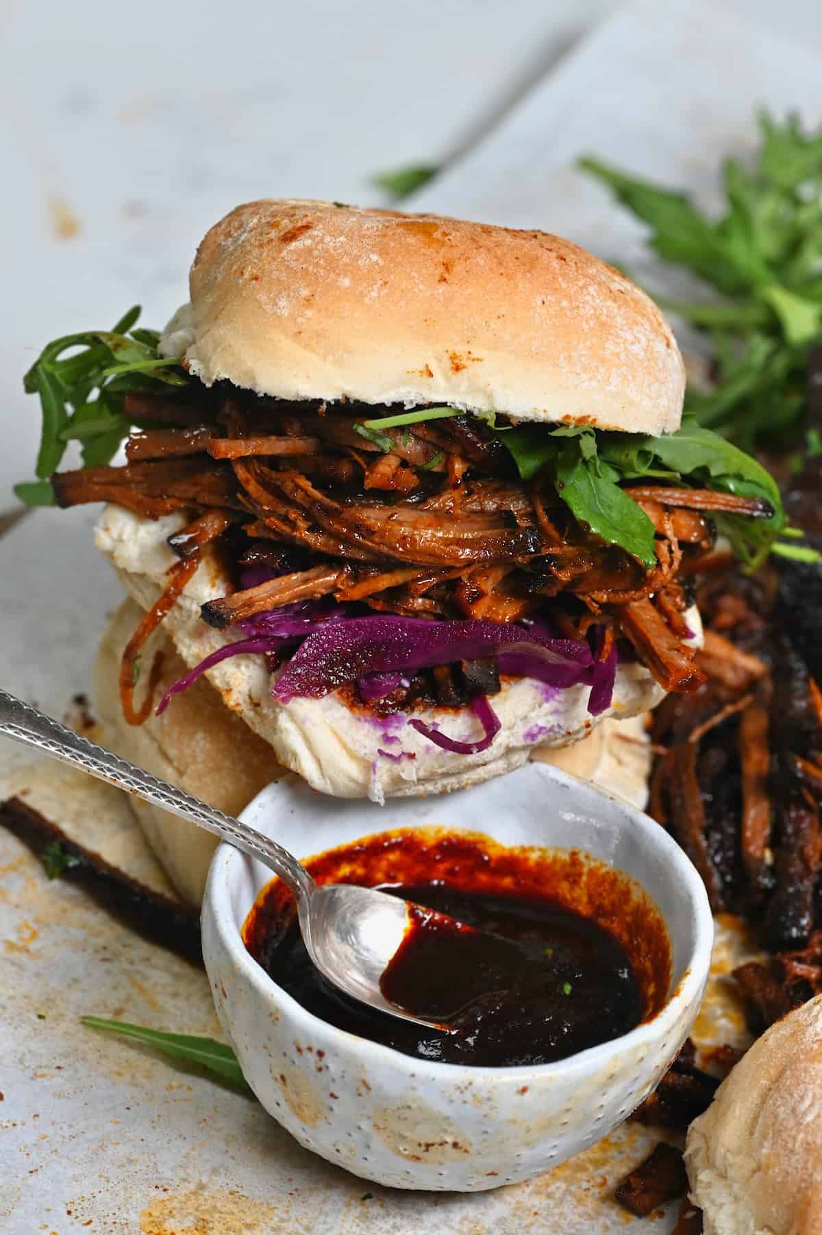 A burger served with homemade BBQ sauce