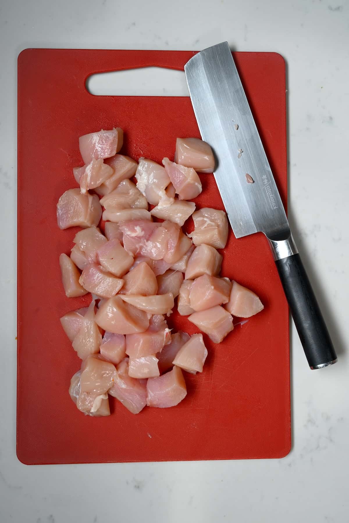 Chopped chicken breasts on a cutting board