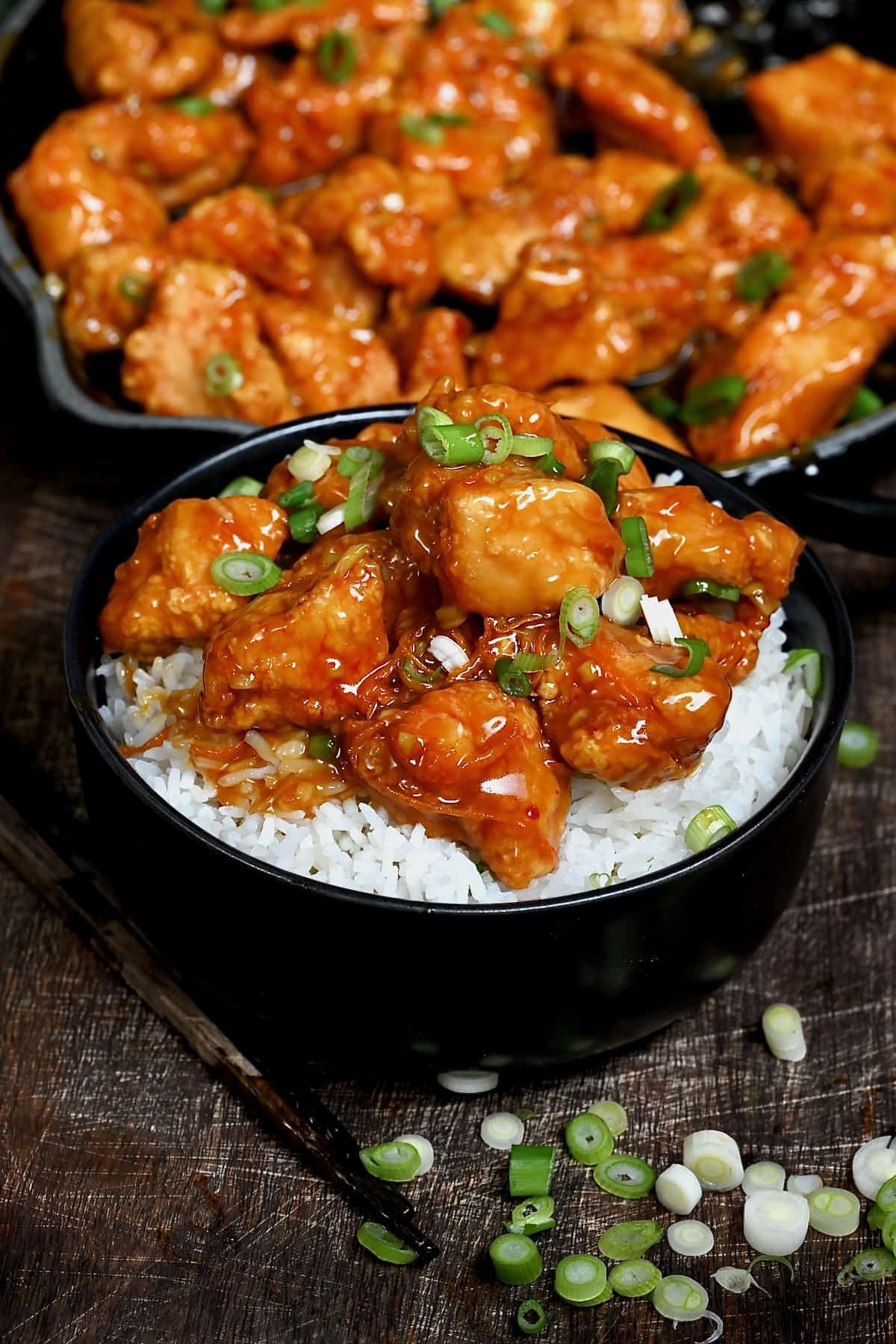 A serving of orange chicken with rice