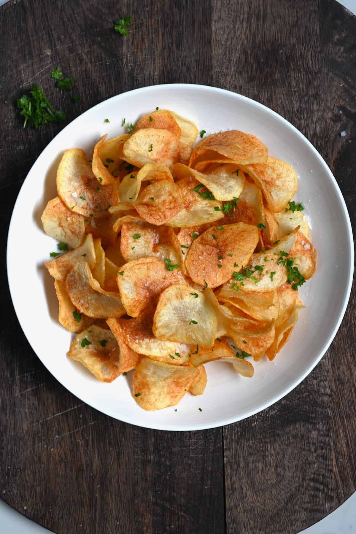 Homemade potato chips on a serving plate