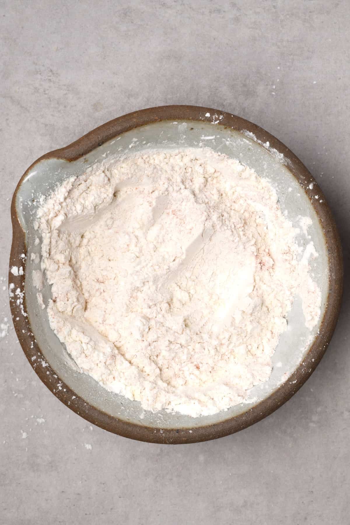 A bowl with dry flour coating for chicken