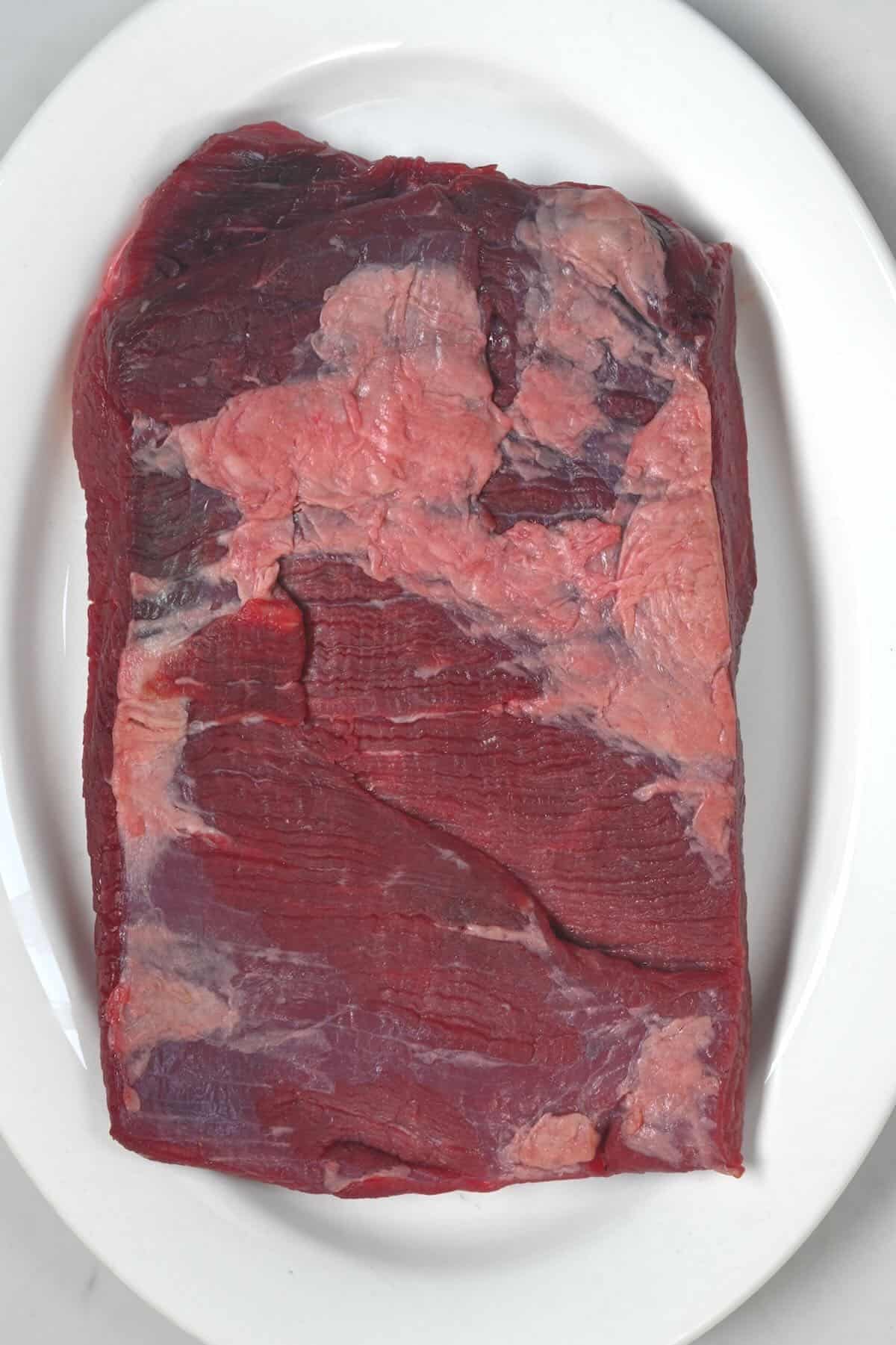 A piece of raw beef brisket