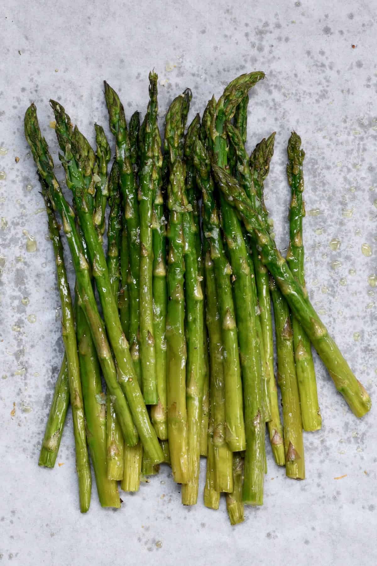 Oven-roasted asparagus on a baking tray