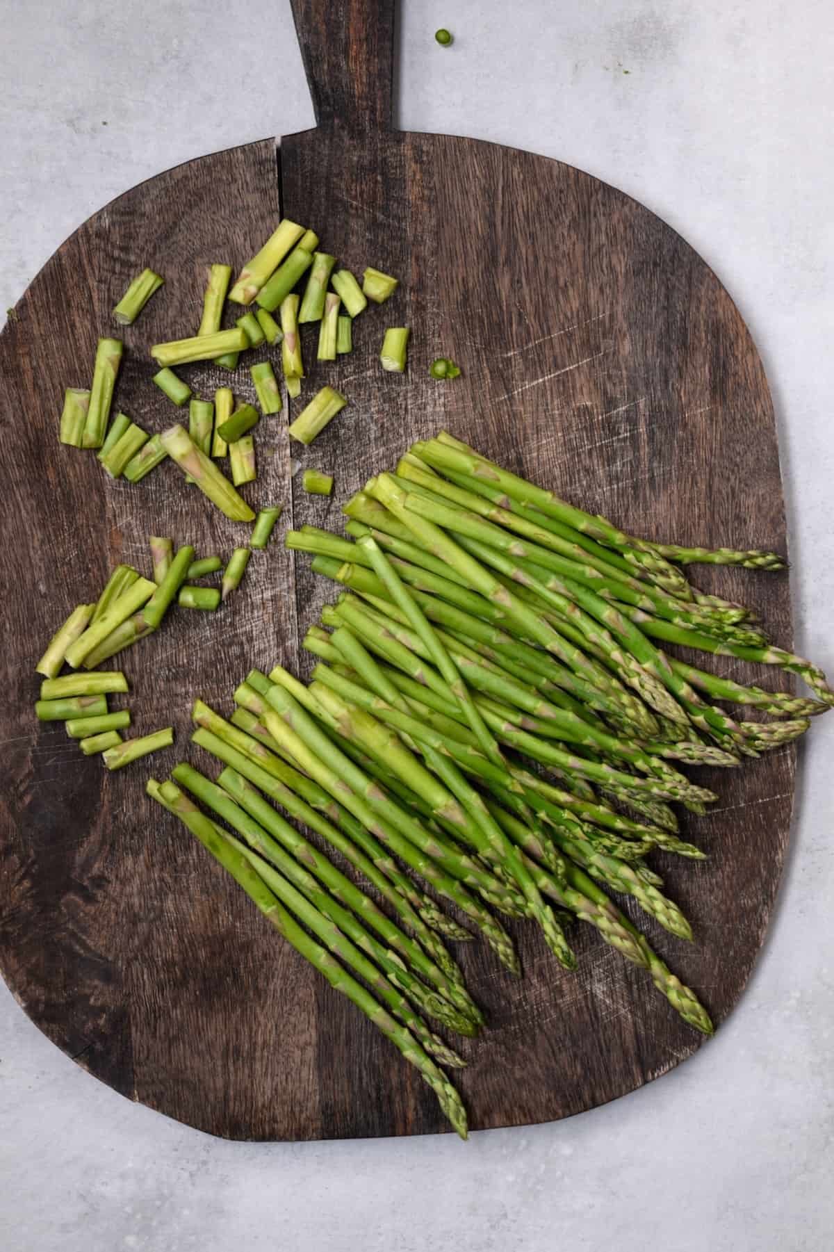 Trimmed asparagus on a chopping board