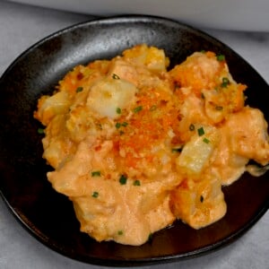A serving of cheesy potatoes casserole