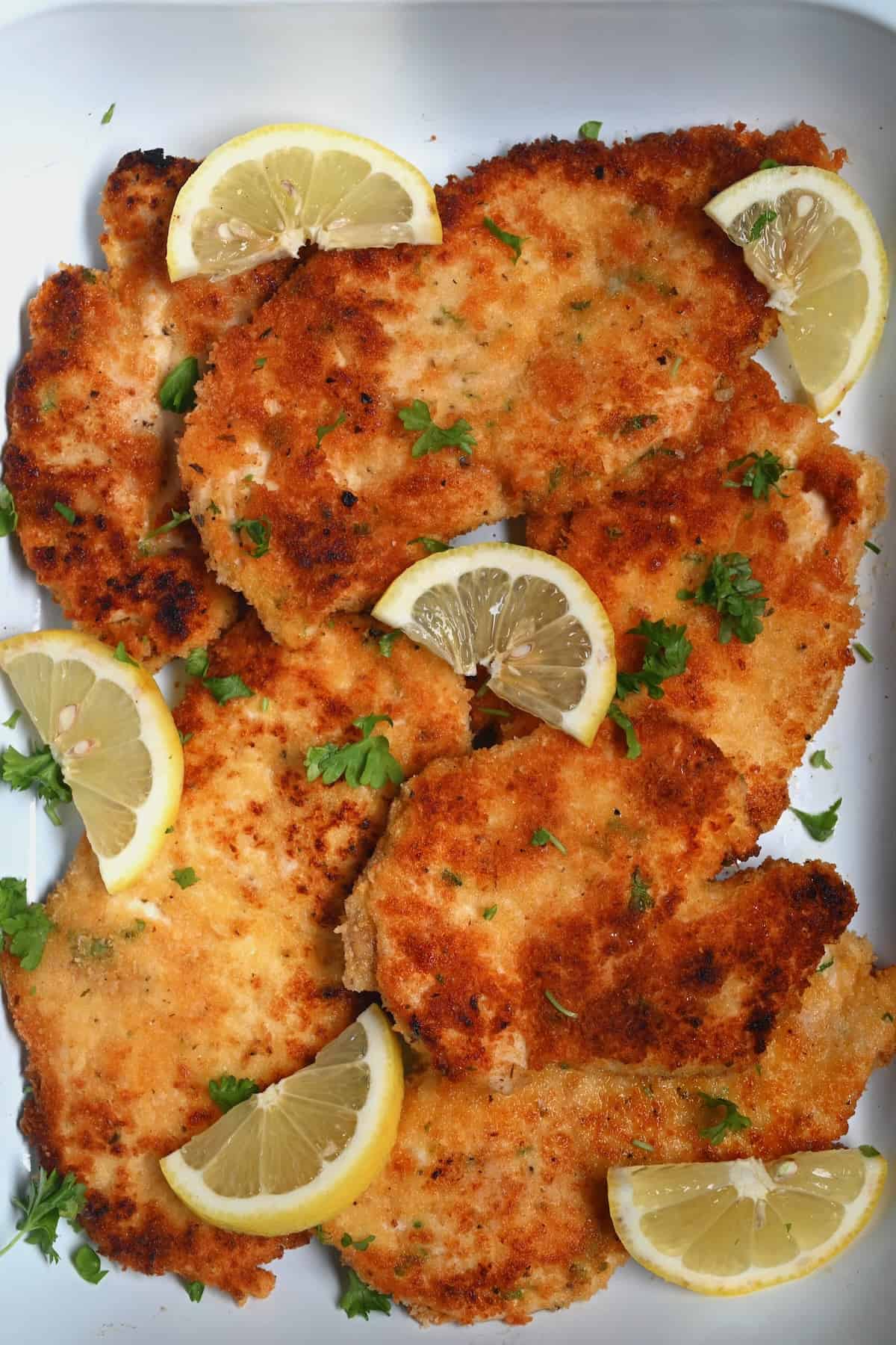 Cooked chicken cutlets in a serving dish