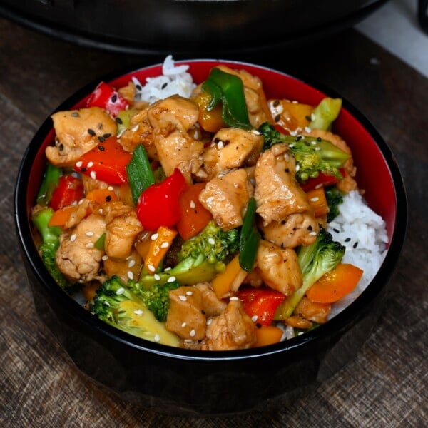 A serving of chicken stir fry over rice
