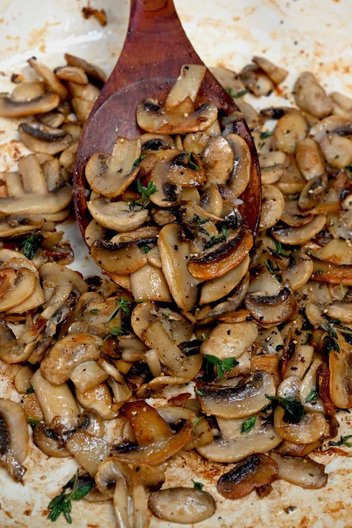 A spoonful of sauteed mushrooms