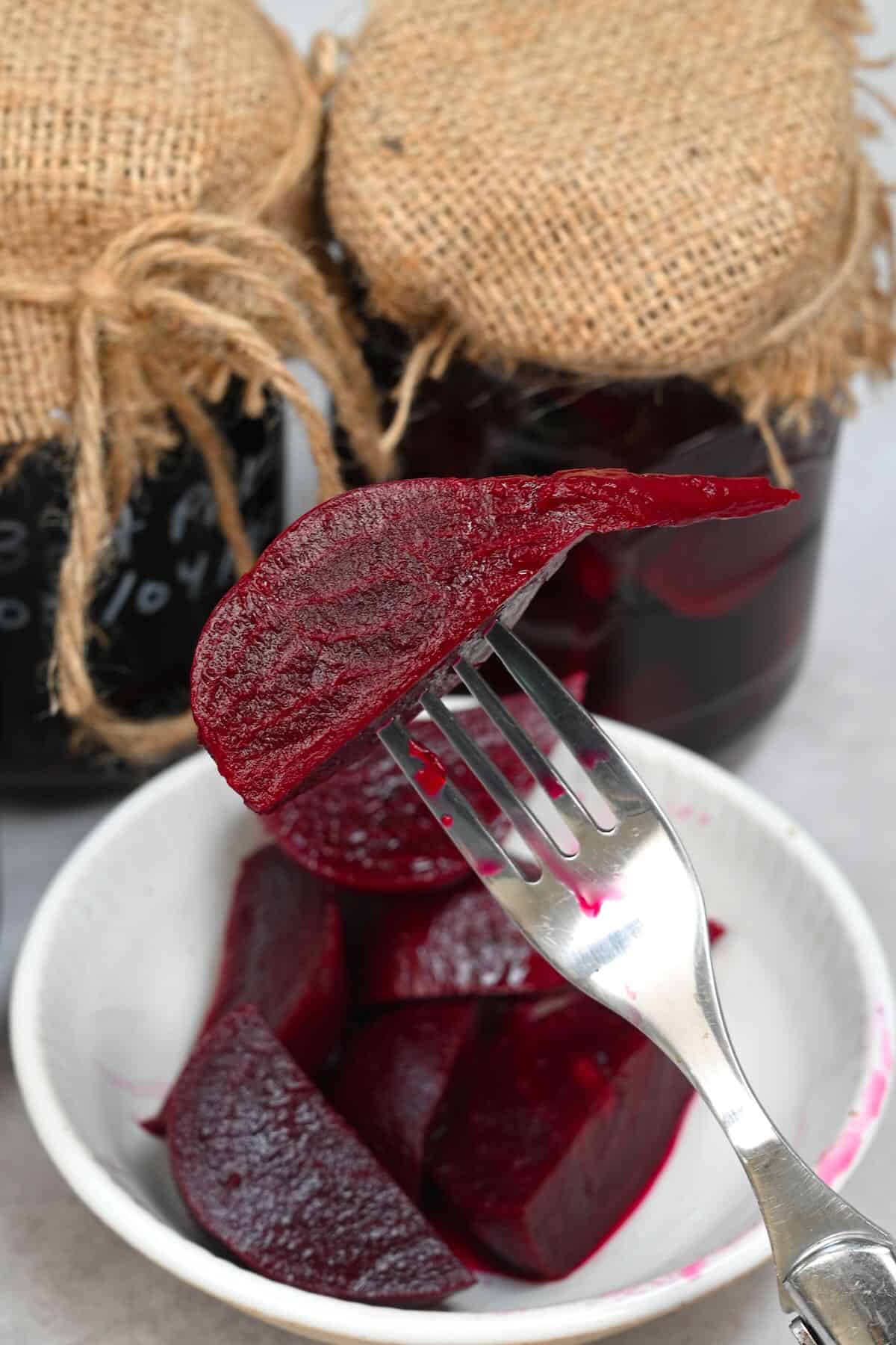 A fork with a pickled beet piece