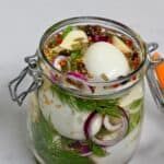 A jar with homemade pickled eggs - 13