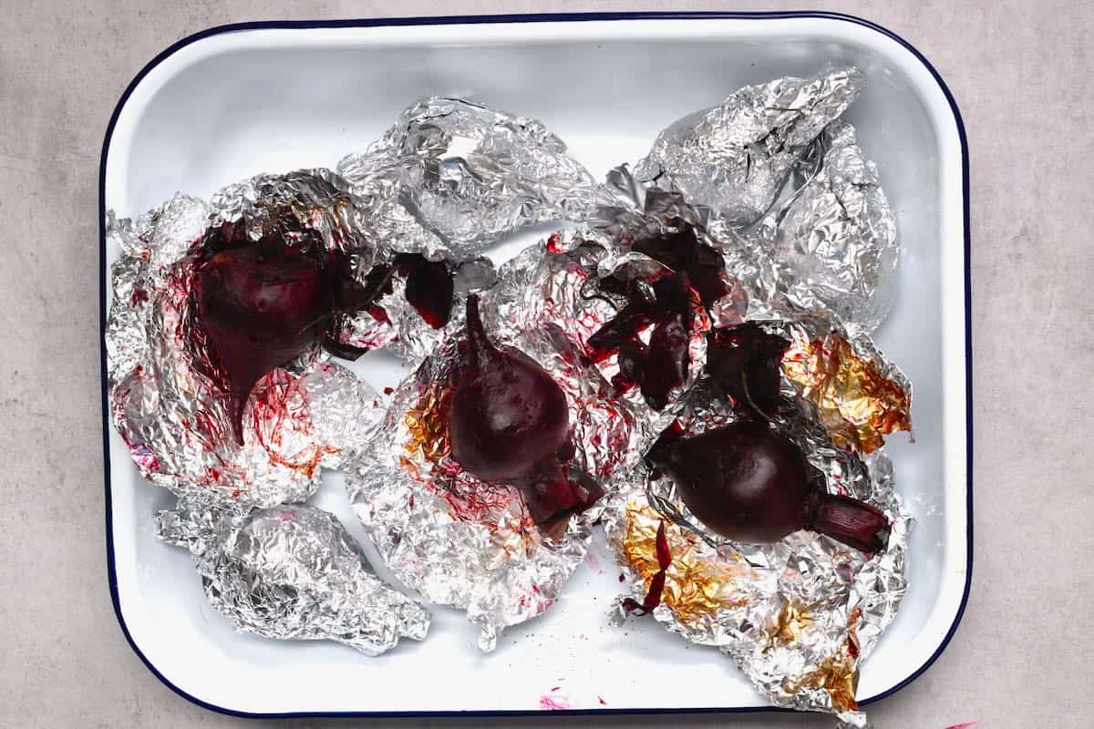 An oven tray with roasted beetroot
