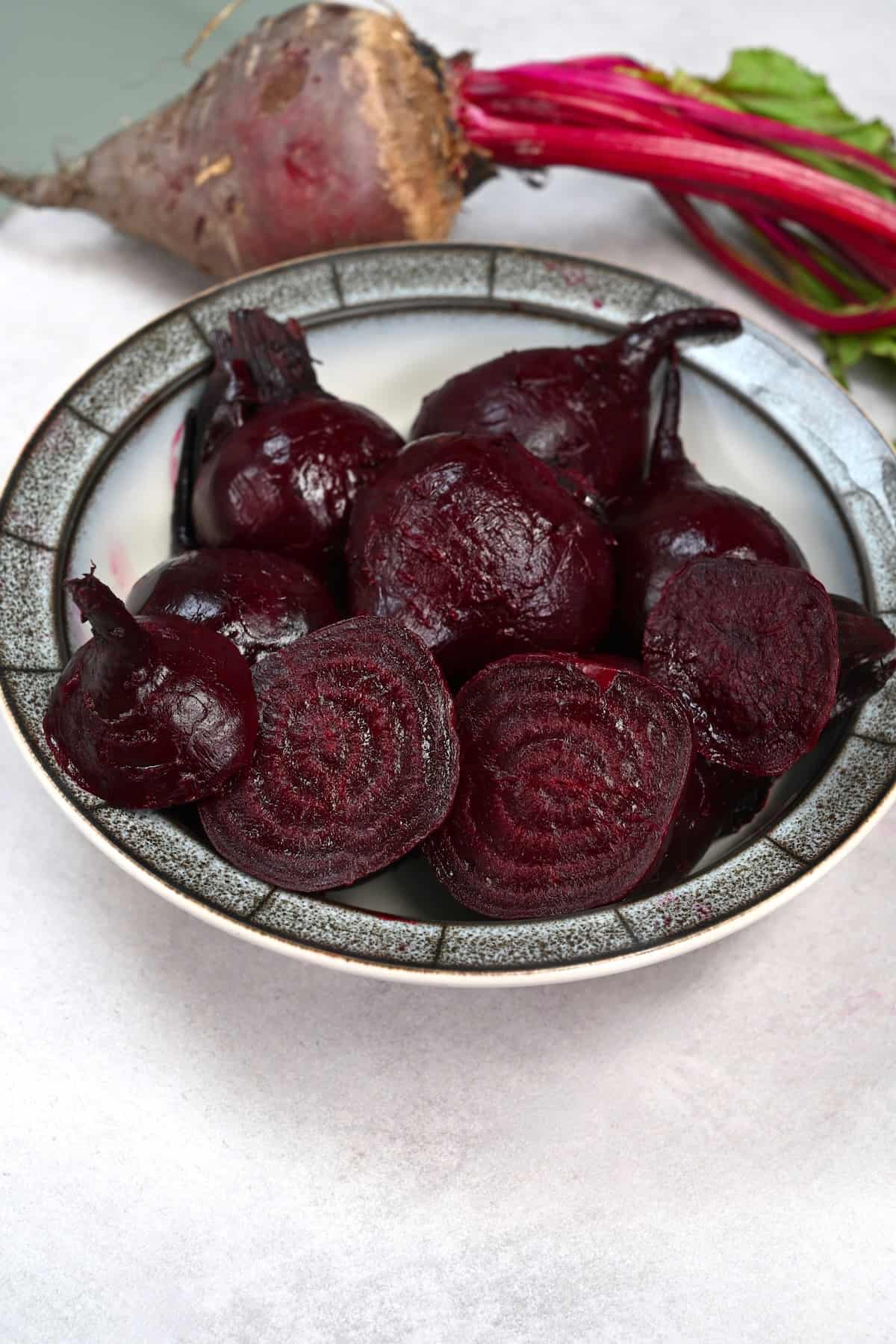 Roasted beets cut in halves on a plate