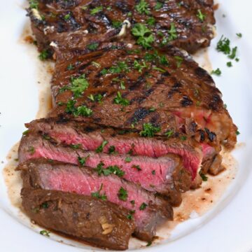 Sliced beef steak on a serving dish