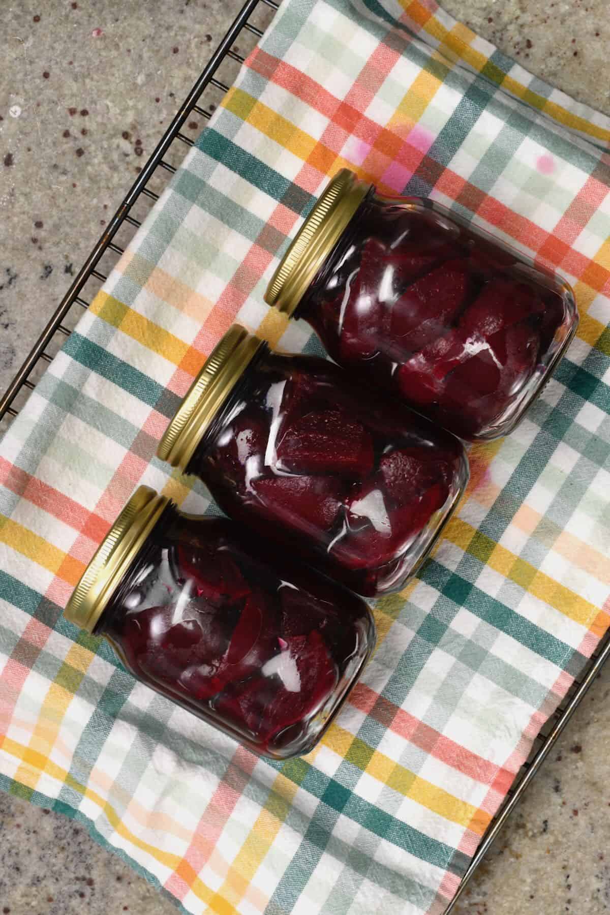 Three jars with pickled beets