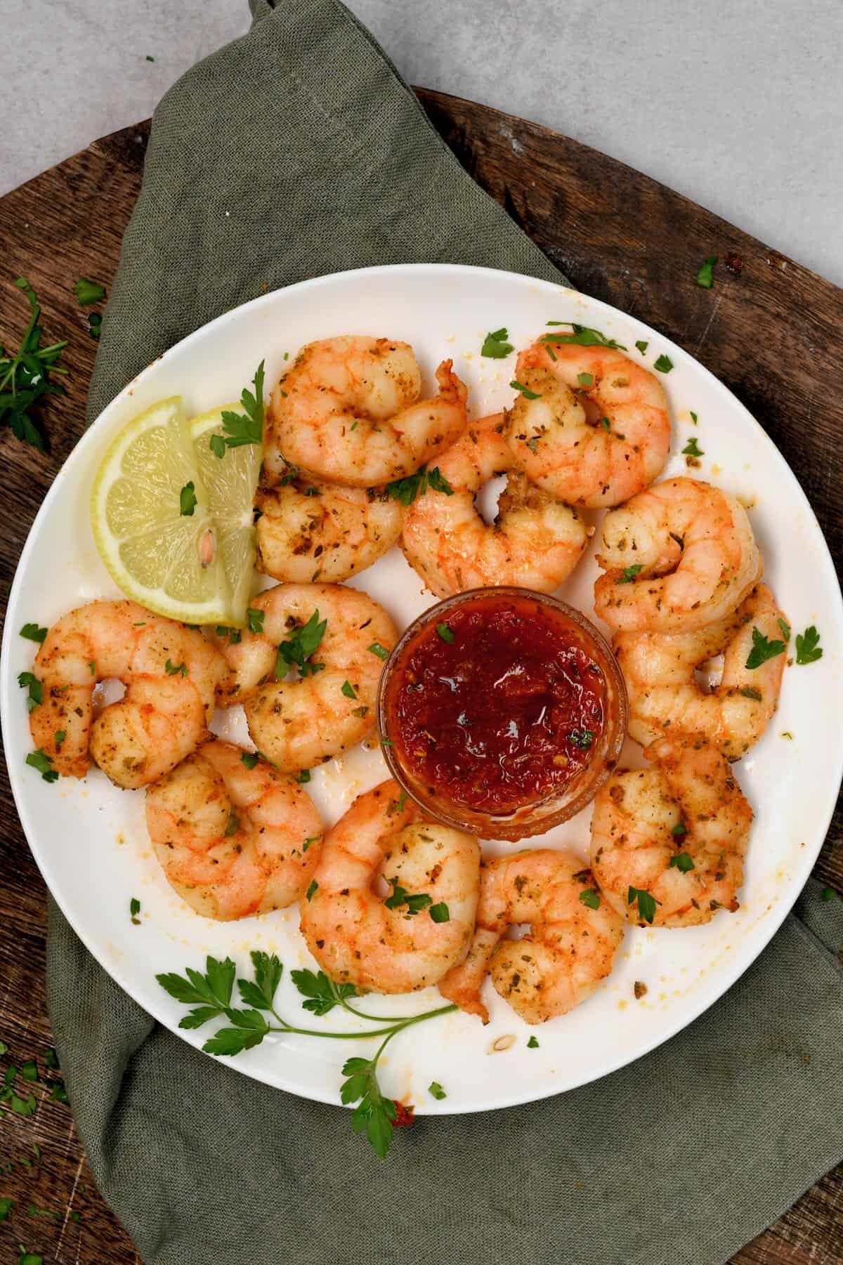 A serving of air fryer shrimp served with red sauce
