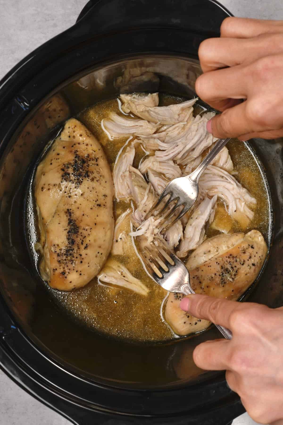 Shredding crockpot chicken with forks