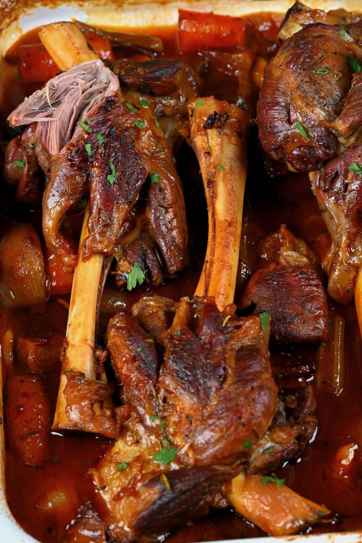 Braised lamb shanks in a tray