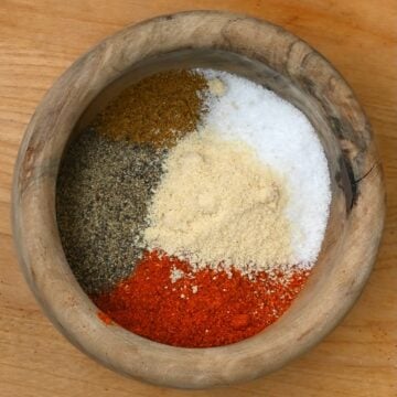 Different spices for chili seasoning in a small bowl