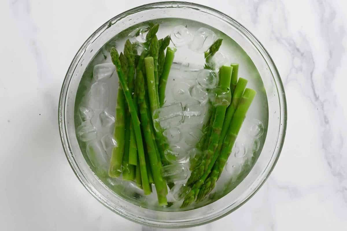Cooling asparagus in an ice bath