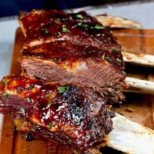 A rack of oven baked beef short ribs with BBQ sauce
