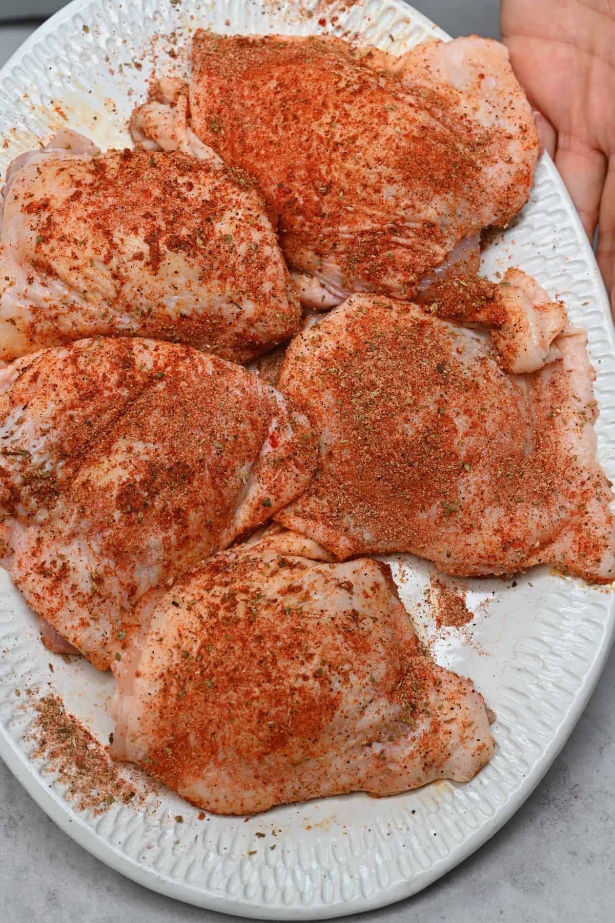 Chicken pieces rubbed with seasoning spices