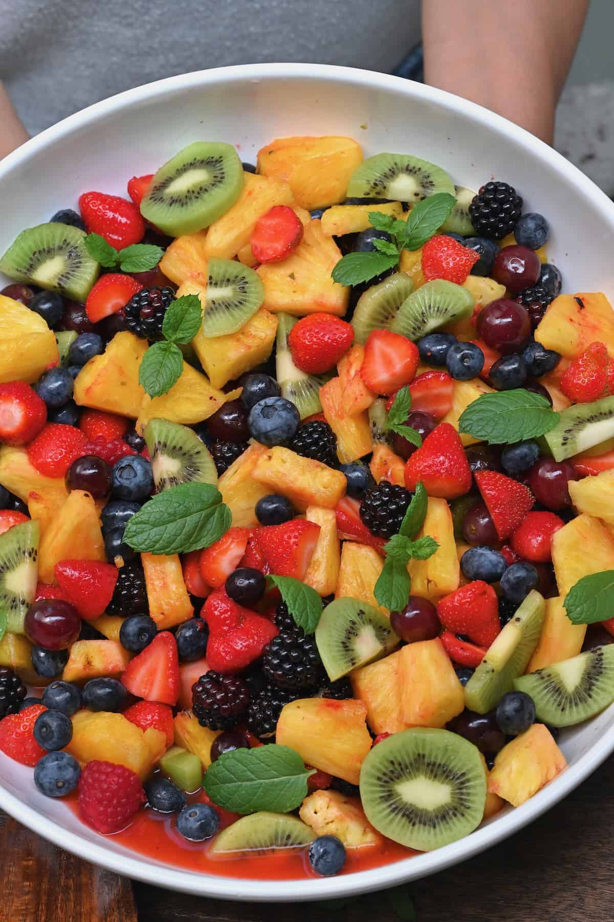 A close-up of fruit salad in a serving bowl