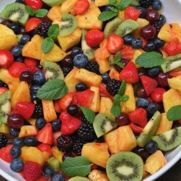 A close-up of fruit salad in a serving bowl