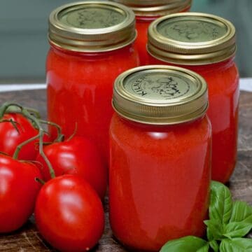 Four jars with homemade tomato puree