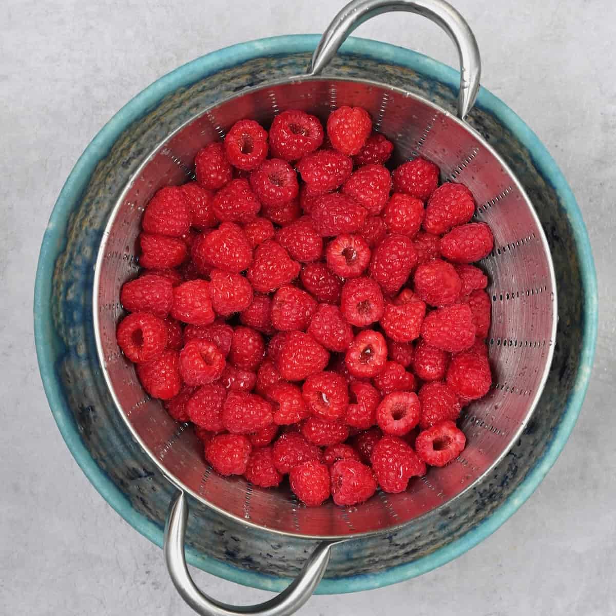 Rinsed raspberries in a bowl