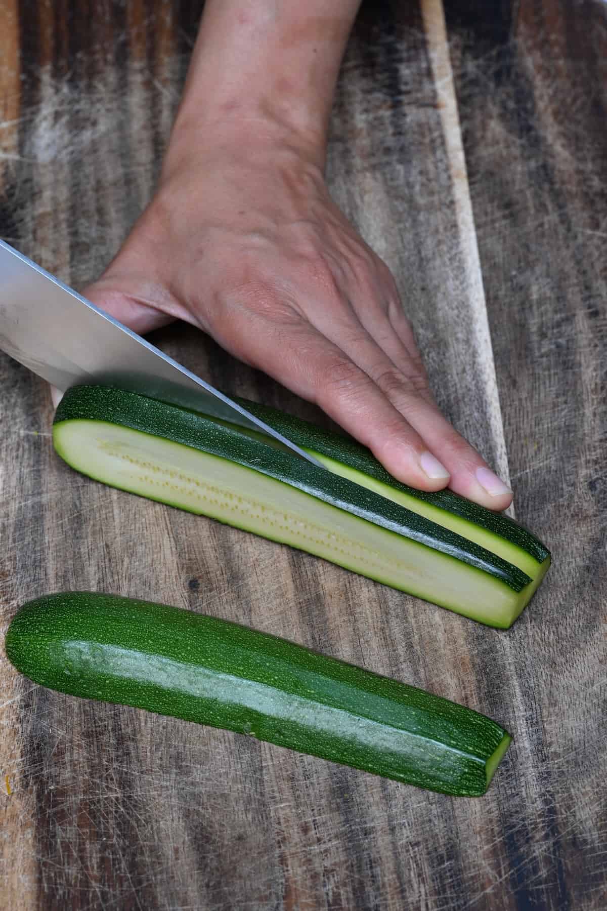 Slicing zucchini to quarter inch thickness
