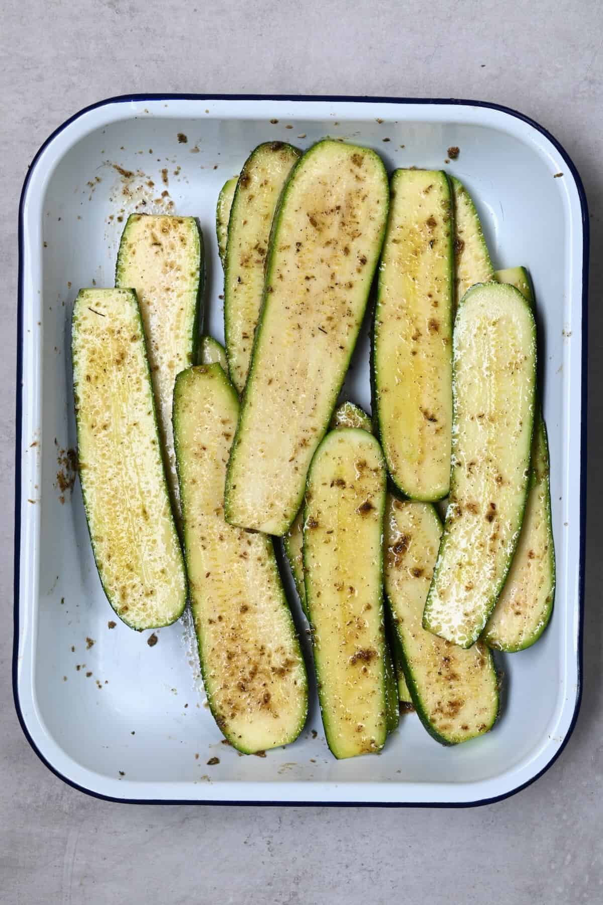 Zucchini slices tossed with oil