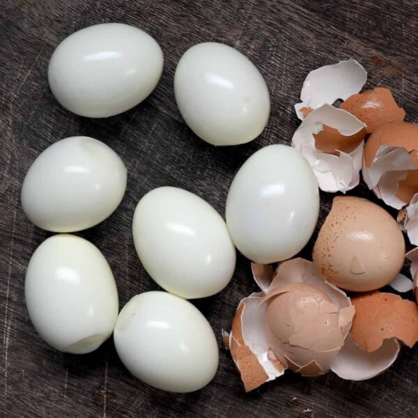 Seven peeled hard boiled eggs