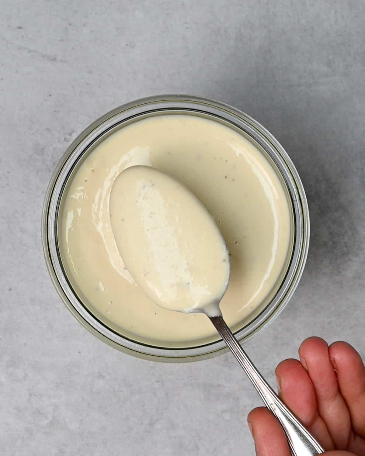 A spoonful of homemade Caesar dressing