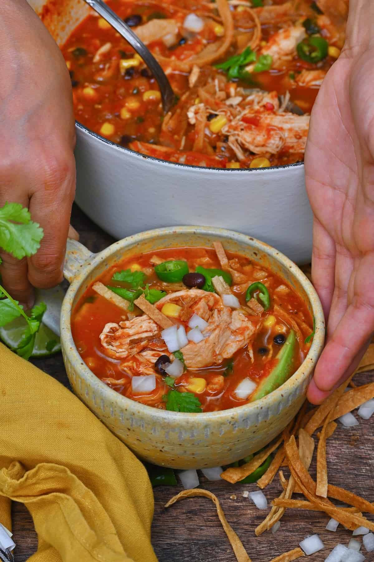 A bowl with homemade chicken tortilla soup