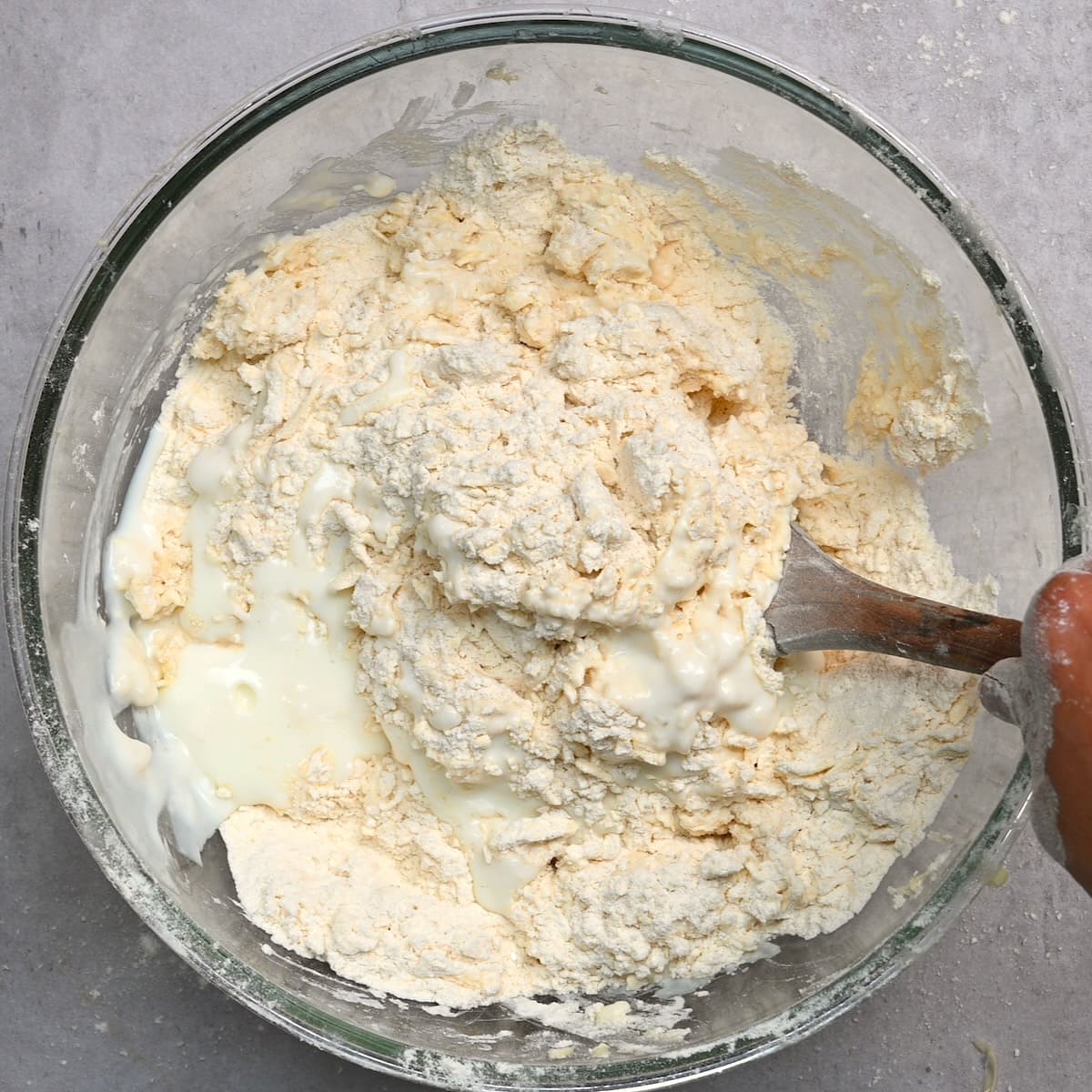 Buttermilk added to dough in a bowl